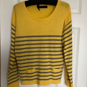 Striped yellow/grey sweater with pockets.